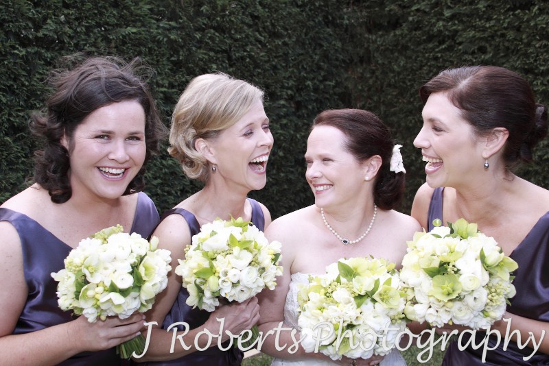 Bride laughing with her bridesmaids - wedding photography sydney